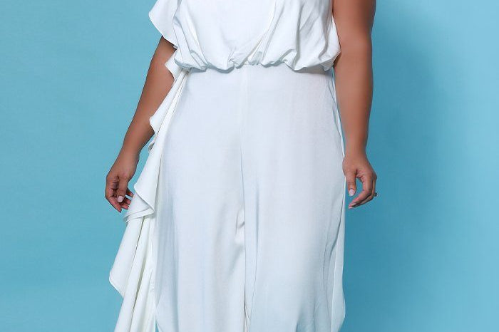 SC5244 Shania Jumpsuit by Sydney's Closet French Crepe fabric bra friendly sleeveless flounce on side of bodice and pant center back zipper available in Ivory