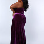Sydney’s Closet SC7342 Deep purple. Slim/Fitted silhouette, strapless with optional spaghetti straps. Modified Basque waist, exposed corset boning on bodice and a ruched waist. Stretch velvet, with high slit and sweep train.