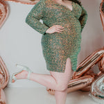 Sydney's CLoset SC8111 short plus size part y  dress with deep V-neckline, long sleeves and high slit. Multi dimensional sequins and ruched bodice.