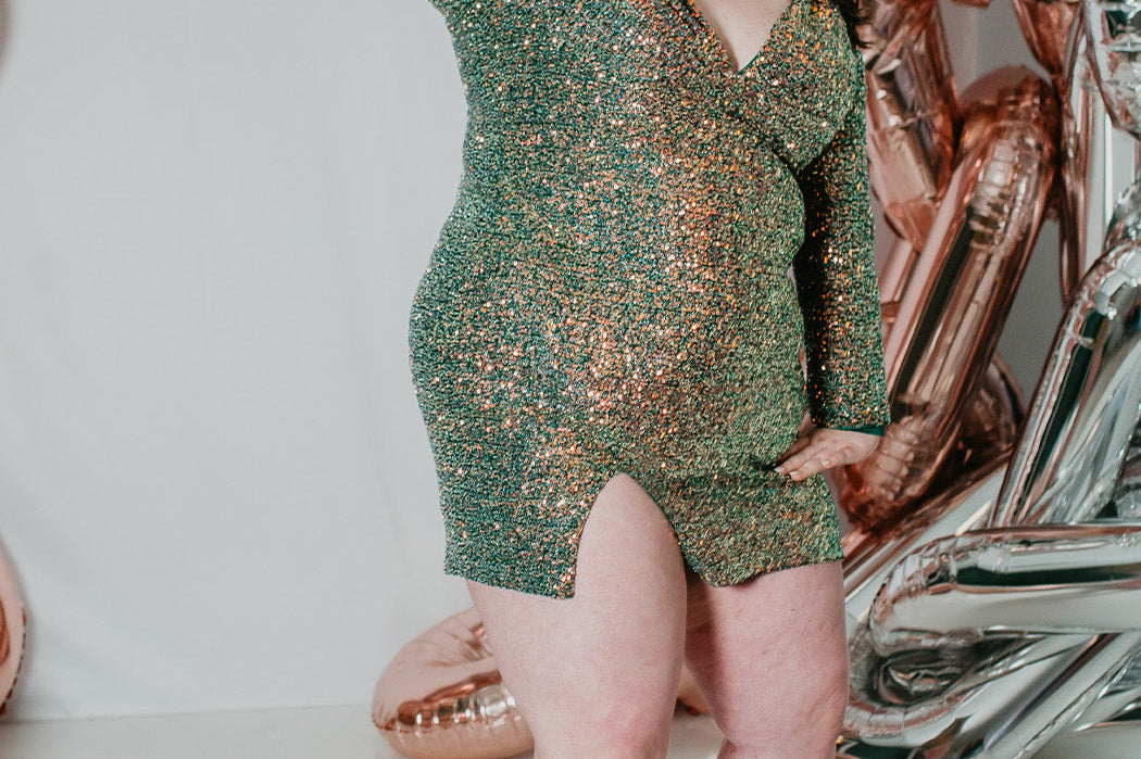 Sydney's CLoset SC8111 short plus size part y  dress with deep V-neckline, long sleeves and high slit. Multi dimensional sequins and ruched bodice.