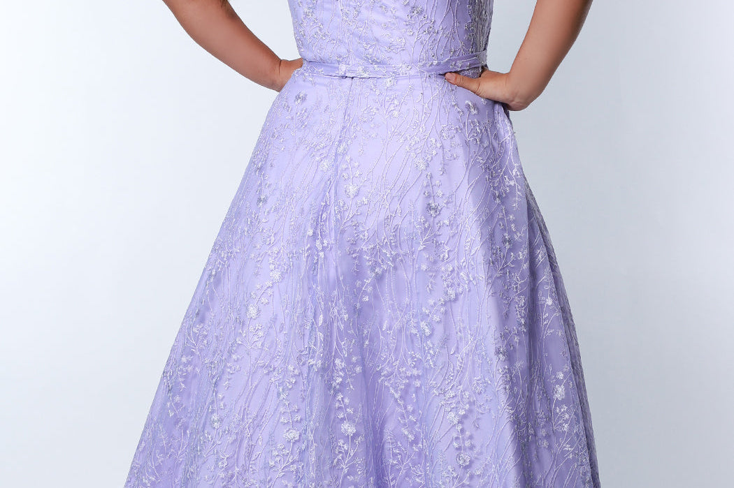 Tease Prom TE2314 light purple.  Fully lined, A-line silhouette, natural waistline  and V-neckline.Ball gown skirt with pockets. Tulle with leaf lace appliques with hot fix stones. Half inch straps covered in lace. Long invisible center back zipper and a detachable self belt. 