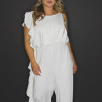 SC5244 Shania Jumpsuit by Sydney's Closet French Crepe fabric bra friendly sleeveless flounce on side of bodice and pant center back zipper available in Ivory