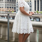LWD style CE2601 in white. Scoop neckline, short sleeve, scalloed hem on sleeves and hem of dress. Princess silohuette, pockets and elegant Guipere lace. Long invisible center back zipper.  Celebrations by Sydney's Closet