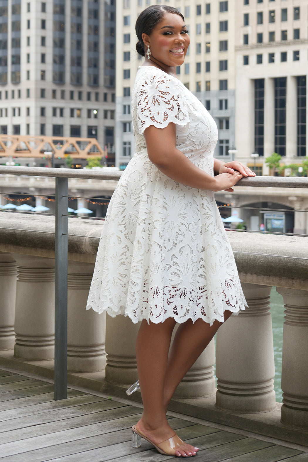 LWD style CE2601 in white. Scoop neckline, short sleeve, scalloed hem on sleeves and hem of dress. Princess silohuette, pockets and elegant Guipere lace. Long invisible center back zipper.  Celebrations by Sydney's Closet