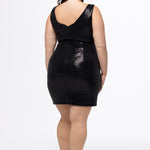 Celebrations by Sydney's Closet style CE2602 in shiny black metallic.  Slim fitted dress on curvy plus size model.  Dress features bra-friendly straps, nude illusion mesh insert, short mini skirt and dimentional sequin fabric with lots of stretch. 