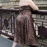 Plus size Tee length animal print dress.  fold over cuff detail, exposed corset boning, natural waistline, and A-line skirt with pockets and center back zipper. CE2603 available in sizes 14-24 in animal print. Celebrations by Sydney's Closet.