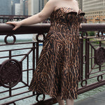 Plus size Tee length animal print dress.  fold over cuff detail, exposed corset boning, natural waistline, and A-line skirt with pockets and center back zipper. CE2603 available in sizes 14-24 in animal print. Celebrations by Sydney's Closet.