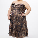 Plus size Tee length animal print dress.  fold over cuff detail, exposed corset boning, natural waistline, and A-line skirt with pockets and center back zipper. CE2603 available in sizes 14-24 in animal print. Celebrations by Sydney's Closet.