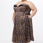 Plus size Tee length animal print dress.  fold over cuff detail, exposed corset boning, natural waistline, and A-line skirt with pockets and center back zipper. CE2603 available in sizes 14-24 in animal print. Celebrations by Sydney's Closet.