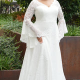Boho crochet lace plus size wedding dress with V-neckline, illusion lace straps, illusion long flowy bell sleeves, natural wiasltine and slim A-line skirt finished with scalloped eyelash hem.  Available in ivory. Celebrations by Sydney's Closet style CE2604