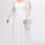 Boho crochet lace plus size wedding dress with V-neckline, illusion lace straps, illusion long flowy bell sleeves, natural wiasltine and slim A-line skirt finished with scalloped eyelash hem.  Available in ivory. Celebrations by Sydney's Closet style CE2604