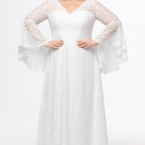 Boho crochet lace plus size wedding dress with V-neckline, illusion lace straps, illusion long flowy bell sleeves, natural wiasltine and slim A-line skirt finished with scalloped eyelash hem.  Available in ivory. Celebrations by Sydney's Closet style CE2604