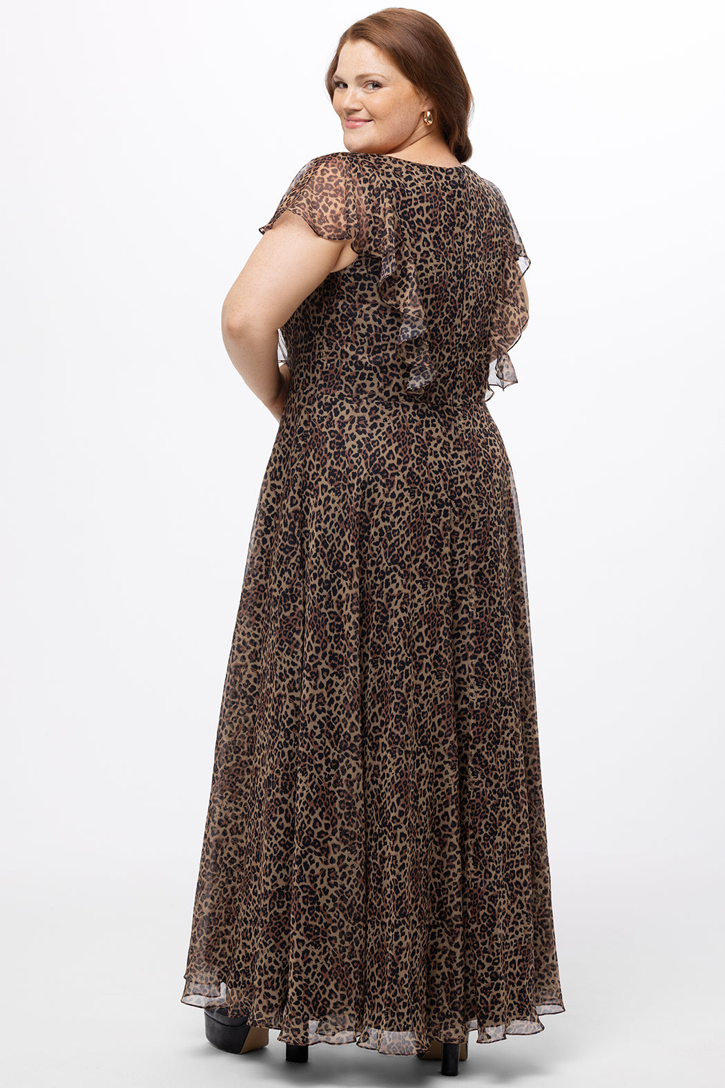 Celebrations by Sydney's Closet style CE2606 in animal print. 

Long plus size animal print dress.  V-neck, short flutter sleeves, natural waistline, pockets and ruffles on bodice princess seams. Left leg slit. Made from printed chiffon and light satin lining. High scoop back and center back zipper. 