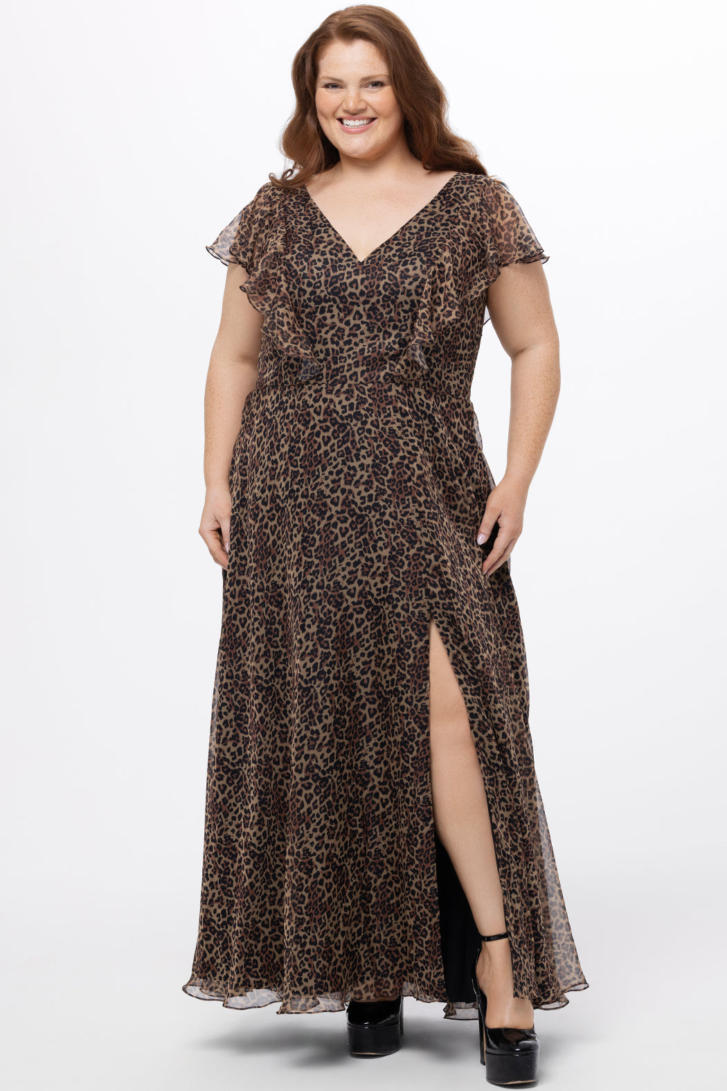 Celebrations by Sydney's Closet style CE2606 in animal print. 

Long plus size animal print dress.  V-neck, short flutter sleeves, natural waistline, pockets and ruffles on bodice princess seams. Left leg slit. Made from printed chiffon and light satin lining. High scoop back and center back zipper. 