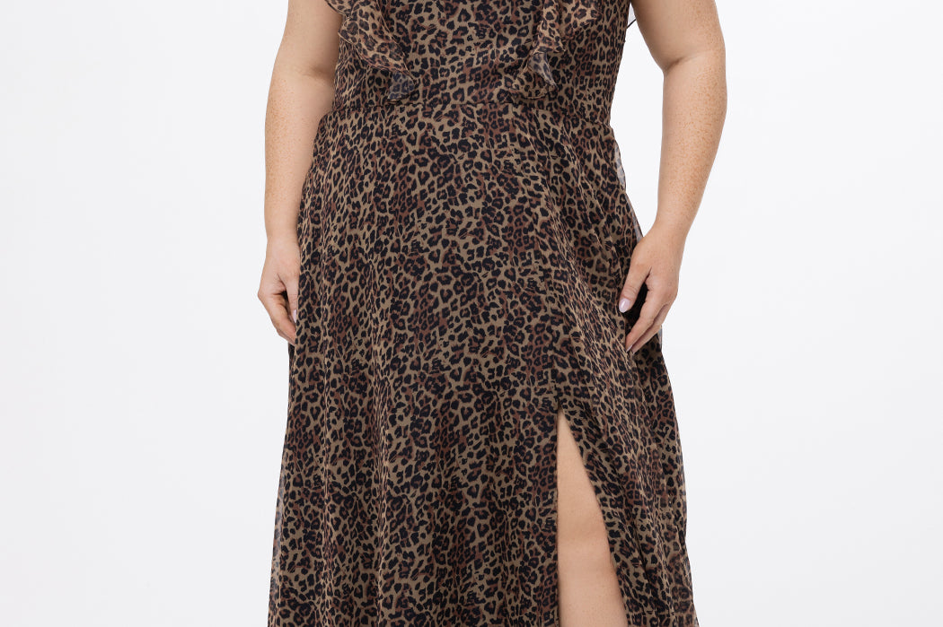 Celebrations by Sydney's Closet style CE2606 in animal print. 

Long plus size animal print dress.  V-neck, short flutter sleeves, natural waistline, pockets and ruffles on bodice princess seams. Left leg slit. Made from printed chiffon and light satin lining. High scoop back and center back zipper. 