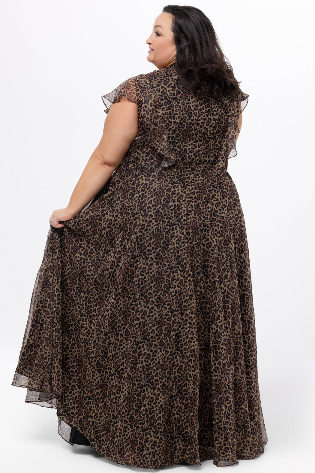 Celebrations by Sydney's Closet style CE2606 in animal print. 

Long plus size animal print dress.  V-neck, short flutter sleeves, natural waistline, pockets and ruffles on bodice princess seams. Left leg slit. Made from printed chiffon and light satin lining. High scoop back and center back zipper. 