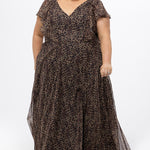 Plus size A-line floor length animal print gown. Flutter cap sleeves, ruffle starting at highpoint of shoulder down to natural waistline. Left leg slit and center back zipper.  CE2606 available in sizes 14-32 in animal print. Celebrations by Sydney's Closet.