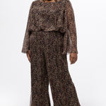 Plus size one-piece animal print jumpsuit. Long flowy chiffon sleeves and blouson bodice, elastic waist, and wide-leg pants. Center back zipper and scoop neckline. CE2607 available in sizes 14-28 in animal print. Celebration's by Sydney's Closet. 