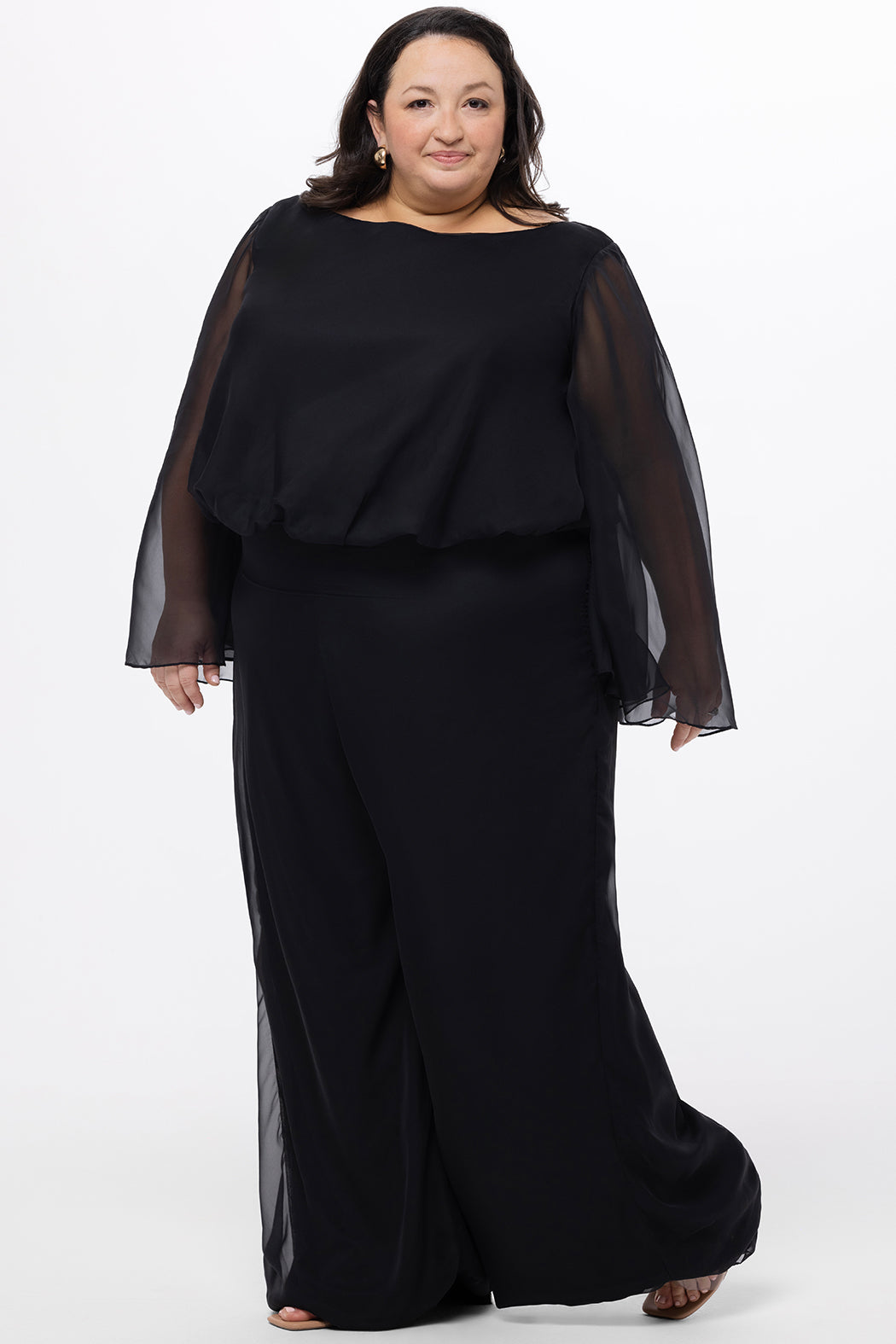 Celebration's by Sydney's Closet style CE2608 in black. 

Scoop neckline, long cape sleeve chiffon jumpsuit. Wide leg pants, blouson bodice and natural waistline. High scoop back with center back zipper. 
