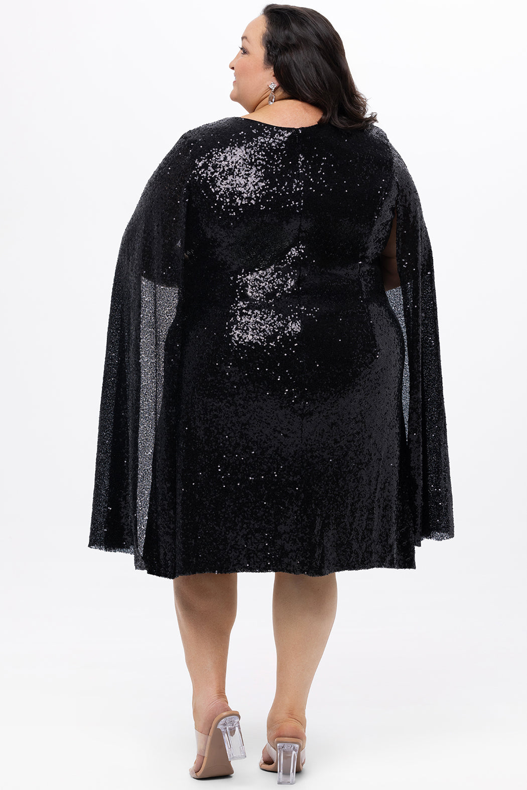 Sydney's Closet CE2609 in black.

Plus size sequin black short party dress. V-neckline, bra-friendly straps with attached cape sleeve detail, princess silhouette, slim A-line skirt. at knee-length.