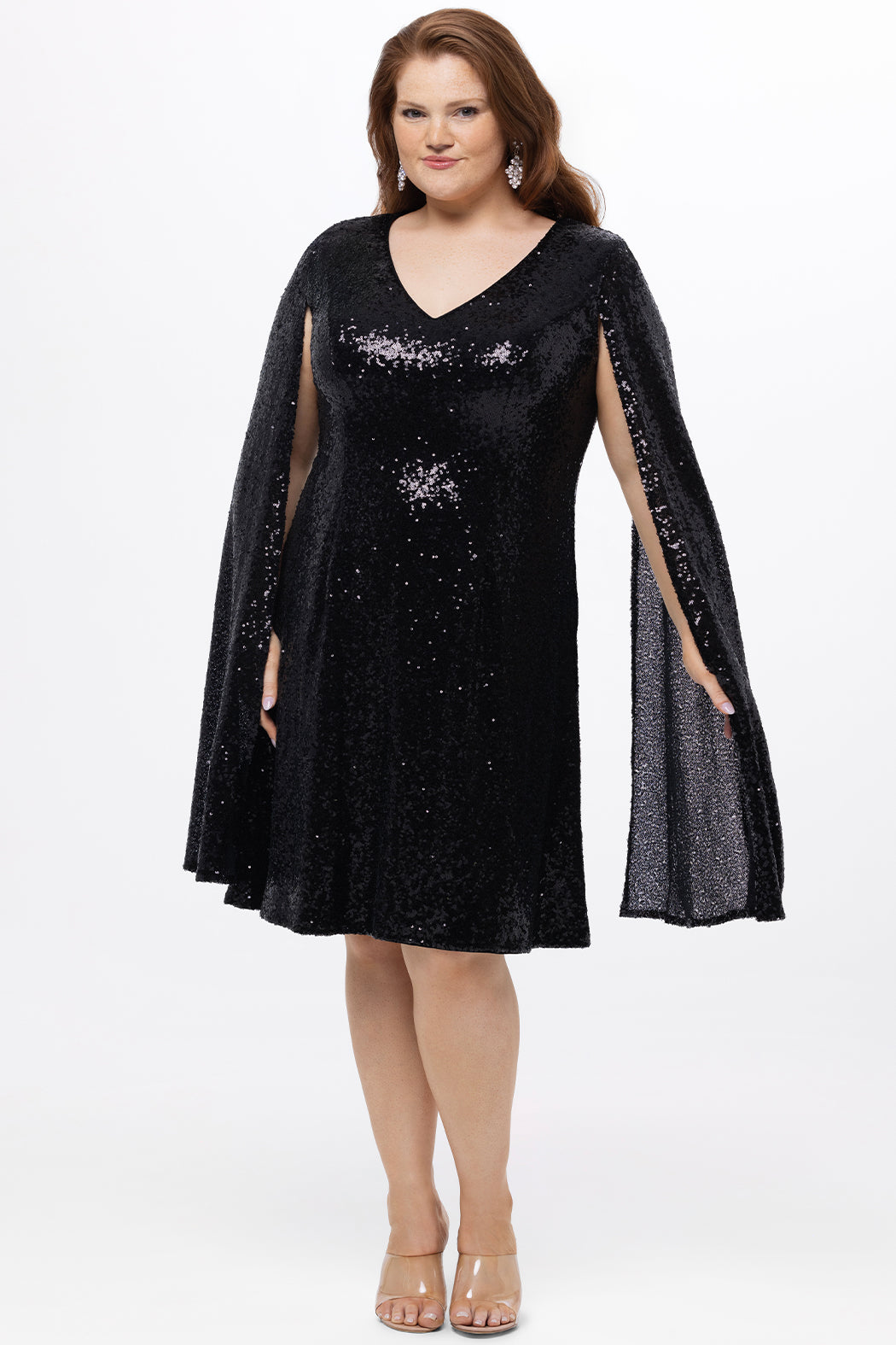 Sydney's Closet CE2609 in black.

Plus size sequin black short party dress. V-neckline, bra-friendly straps with attached cape sleeve detail, princess silhouette, slim A-line skirt. at knee-length.