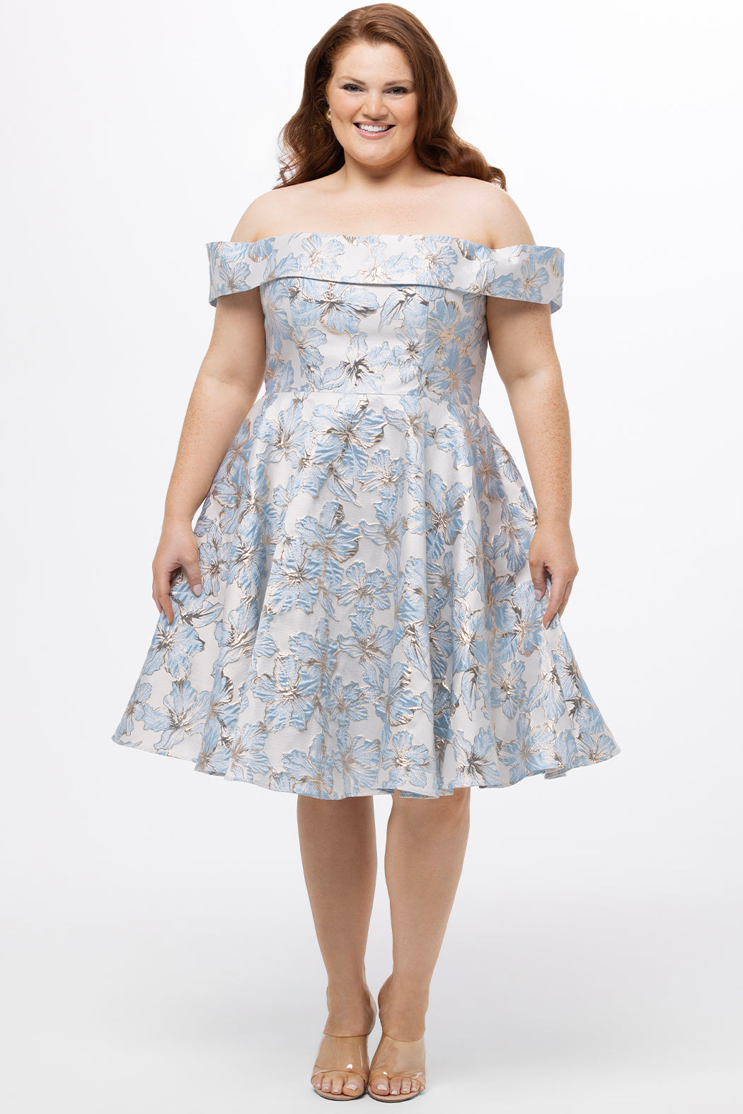 Celebrations by Sydney's Closet CE2610 in Light Blue Floral. 

Plus size knee-length party dress in metallic light blue floral brocde print. Off-the-shoulder neckline, natural waistline and A-line skirt with pockets. 