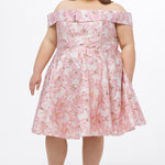 Celebrations by Sydney's Closet CE2610 in Light Pink Floral. 

Plus size knee-length party dress in metallic light pink floral brocde print. Off-the-shoulder neckline, natural waistline and A-line skirt with pockets. 