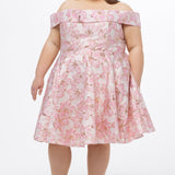 Celebrations by Sydney's Closet CE2610 in Light Pink Floral. 

Plus size knee-length party dress in metallic light pink floral brocde print. Off-the-shoulder neckline, natural waistline and A-line skirt with pockets. 