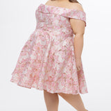 Celebrations by Sydney's Closet CE2610 in Light Pink Floral. 

Plus size knee-length party dress in metallic light pink floral brocde print. Off-the-shoulder neckline, natural waistline and A-line skirt with pockets. 