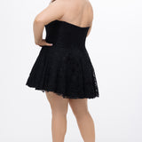 Celebrations by Sydney's Closet Style CE2612 in black. 

Plus size strapless black short mini party dress with sweetheart neckline, exposed corset boning on bustier bodice and mini skirt in all over stretch lace. 