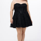 Celebrations by Sydney's Closet Style CE2612 in black. 

Plus size strapless black short mini party dress with sweetheart neckline, exposed corset boning on bustier bodice and mini skirt in all over stretch lace. 