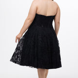 Celebrations by Sydney's Closet Style CE2613 in black. 

Plus size strapless black tea-length dress with sweetheart neckline, exposed corset boning on bustier bodice and tea-length skirt in all over stretch lace. 