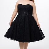Celebrations by Sydney's Closet Style CE2613 in black. 

Plus size strapless black tea-length dress with sweetheart neckline, exposed corset boning on bustier bodice and tea-length skirt in all over stretch lace. 