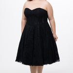 Celebrations by Sydney's Closet Style CE2613 in black. 

Plus size strapless black tea-length dress with sweetheart neckline, exposed corset boning on bustier bodice and tea-length skirt in all over stretch lace. 