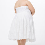 Celebrations by Sydney's Closet Style CE2613 in white. 

Plus size strapless white tea-length dress with sweetheart neckline, exposed corset boning on bustier bodice and tea-length skirt in all over stretch lace. 