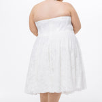 Celebrations by Sydney's Closet Style CE2613 in white. 

Plus size strapless white tea-length dress with sweetheart neckline, exposed corset boning on bustier bodice and tea-length skirt in all over stretch lace. 