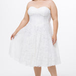 Celebrations by Sydney's Closet Style CE2613 in white. 

Plus size strapless white tea-length dress with sweetheart neckline, exposed corset boning on bustier bodice and tea-length skirt in all over stretch lace. 