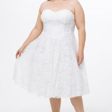 Celebrations by Sydney's Closet Style CE2613 in white. 

Plus size strapless white tea-length dress with sweetheart neckline, exposed corset boning on bustier bodice and tea-length skirt in all over stretch lace. 