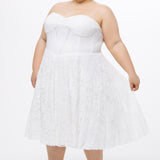 Celebrations by Sydney's Closet Style CE2613 in white. 

Plus size strapless white tea-length dress with sweetheart neckline, exposed corset boning on bustier bodice and tea-length skirt in all over stretch lace. 