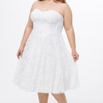 Celebrations by Sydney's Closet Style CE2613 in white. 

Plus size strapless white tea-length dress with sweetheart neckline, exposed corset boning on bustier bodice and tea-length skirt in all over stretch lace. 