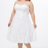 Celebrations by Sydney's Closet Style CE2613 in white. 

Plus size strapless white tea-length dress with sweetheart neckline, exposed corset boning on bustier bodice and tea-length skirt in all over stretch lace. 