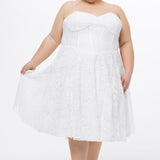 Celebrations by Sydney's Closet Style CE2613 in white. 

Plus size strapless white tea-length dress with sweetheart neckline, exposed corset boning on bustier bodice and tea-length skirt in all over stretch lace. 