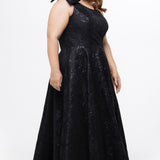 Celebrations by Sydney's Closet Style CE2614 in Black

Plus size maxi length formal dress. One-shoulder neckline with detachable bow at high point of shoulder, natural waistline and A-line skirt with pockets. 

Black floral brocade fabric. 