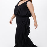 Celebrations by Sydney's Closet Style CE2615 in Black.

One-piece crepe satin jumpsuit with ruffled on outer pants seams. Bra-friendly straps, blouson bodice and wide leg pants. Center back zipper and scoop neckline. 