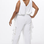 Celebration's by Sydney's Closet style CE2615 in Ivory. 

Crepe satin jumpsuit with a V-neck, bra-friendly straps, wide leg pants and blouson bodice. Ruffle detail on outer seams of pants. V-back with long center back zipper. 