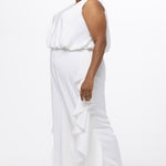 Celebration's by Sydney's Closet style CE2615 in Ivory. 

Crepe satin jumpsuit with a V-neck, bra-friendly straps, wide leg pants and blouson bodice. Ruffle detail on outer seams of pants. V-back with long center back zipper. 