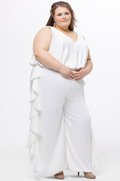Celebration's by Sydney's Closet style CE2615 in Ivory. 

Crepe satin jumpsuit with a V-neck, bra-friendly straps, wide leg pants and blouson bodice. Ruffle detail on outer seams of pants. V-back with long center back zipper. 