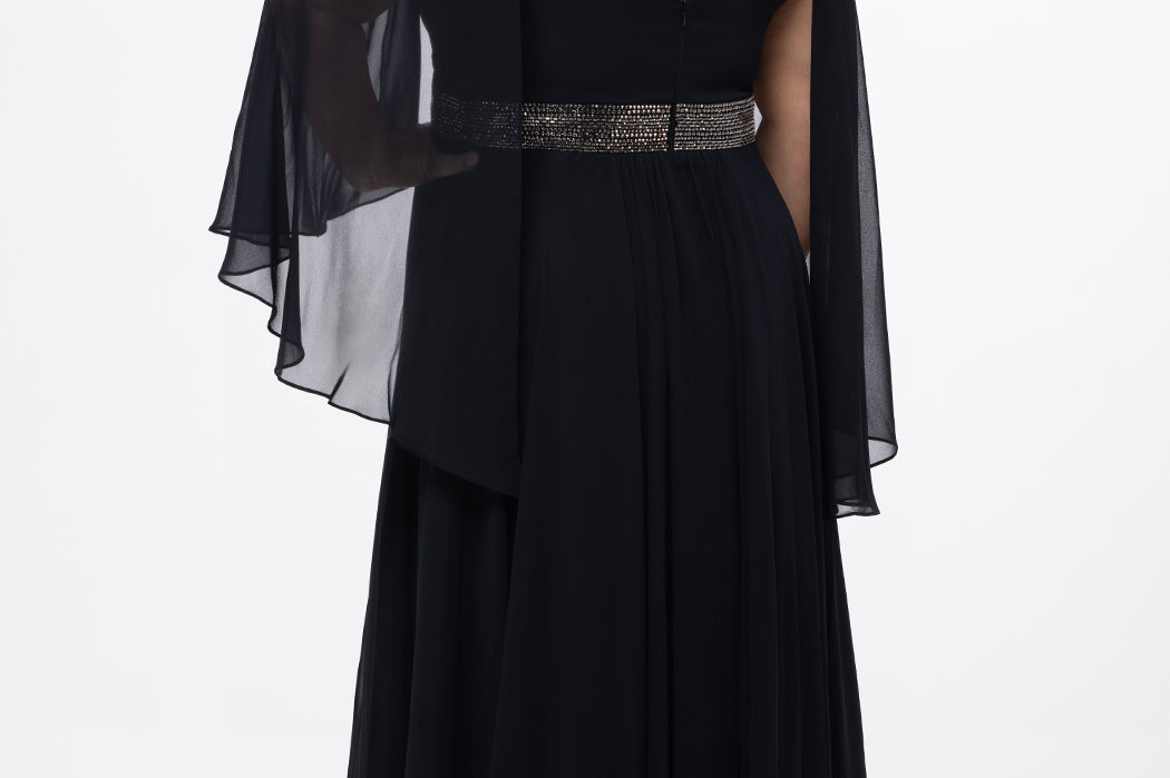 elebration's by Sydney's Closet style CE2617 in black. 

A-line plus size chiffon gown with V-neck, long cape sleeves and beaded 3 inch waistband. No slit, center back zipper and high scoop back.