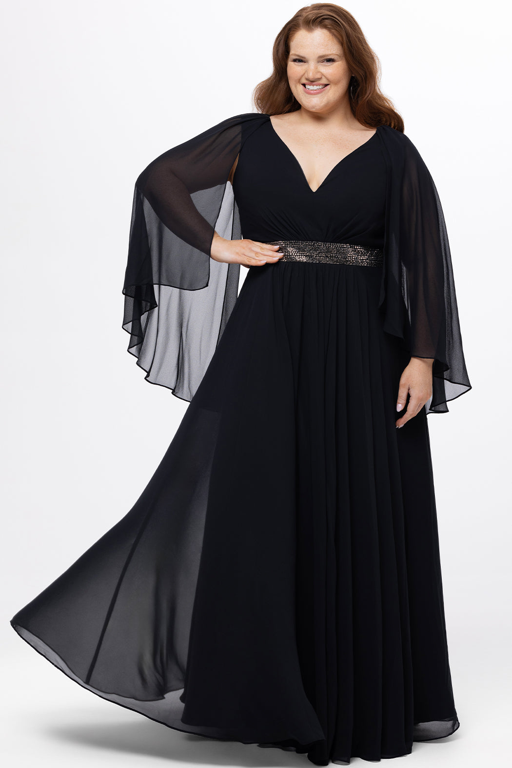 elebration's by Sydney's Closet style CE2617 in black. 

A-line plus size chiffon gown with V-neck, long cape sleeves and beaded 3 inch waistband. No slit, center back zipper and high scoop back.