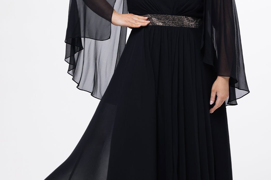 elebration's by Sydney's Closet style CE2617 in black. 

A-line plus size chiffon gown with V-neck, long cape sleeves and beaded 3 inch waistband. No slit, center back zipper and high scoop back.